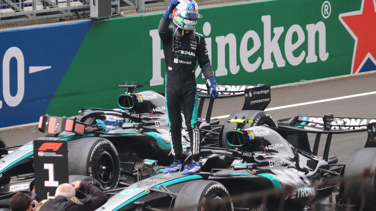 Kimi Antonelli standing on his Mercedes car to celebrate winning the 2026 Chinese Grand Prix