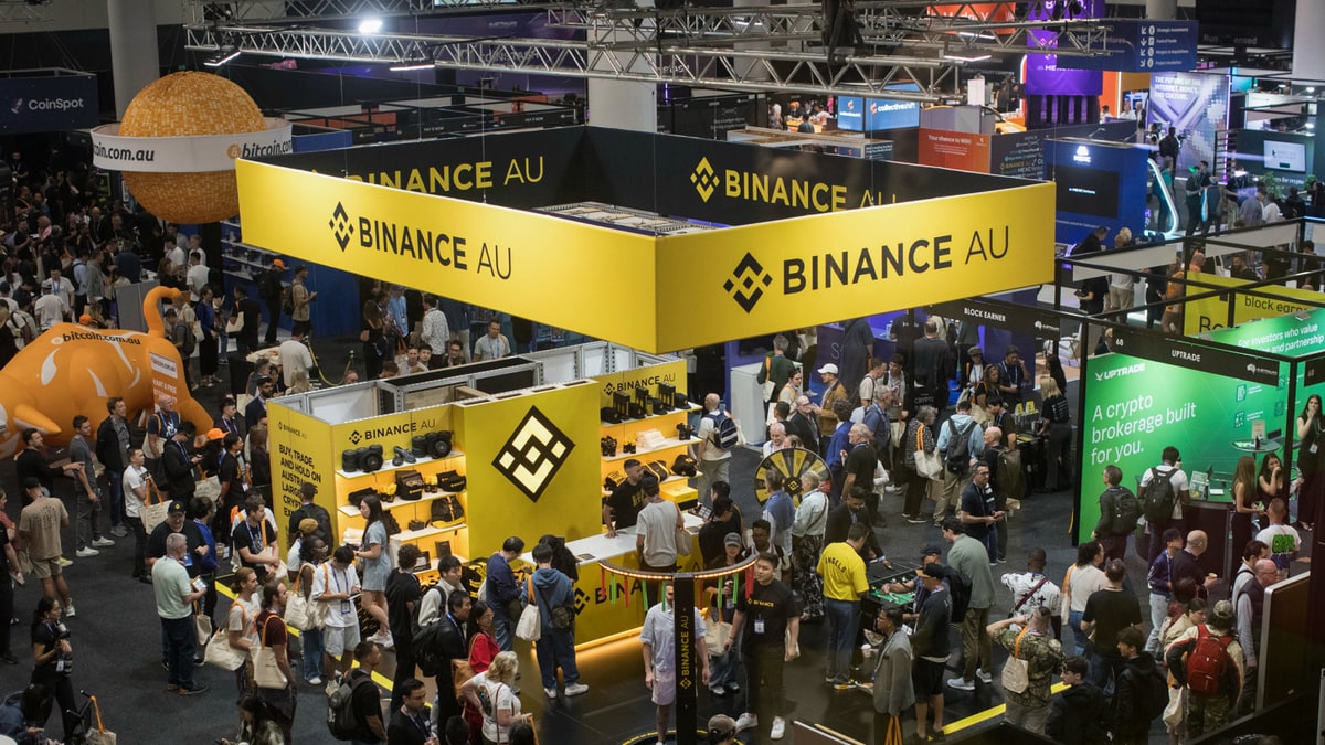 Crowds around the Binance stand at a crypto conference in Australia