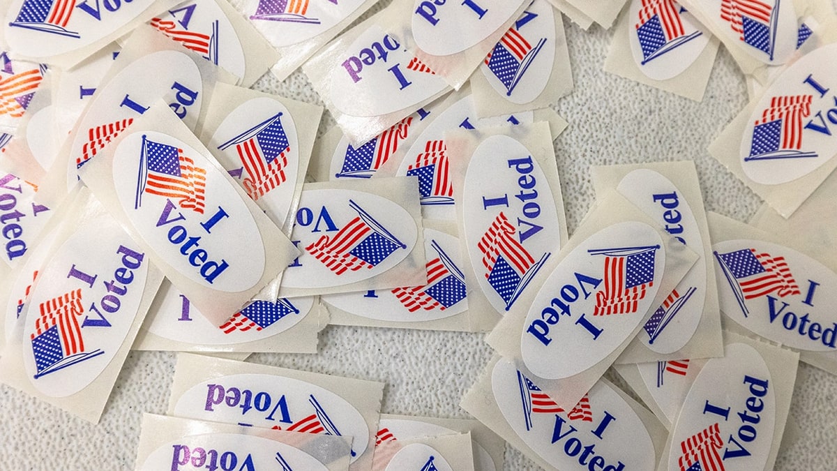A pile of US 'I Voted' stickers with the American flag