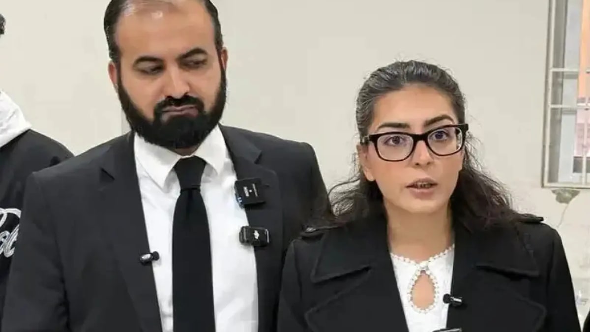 Hadi Ali Chattha and Imaan Mazari in black lawyers coats speaking to the media, file photo