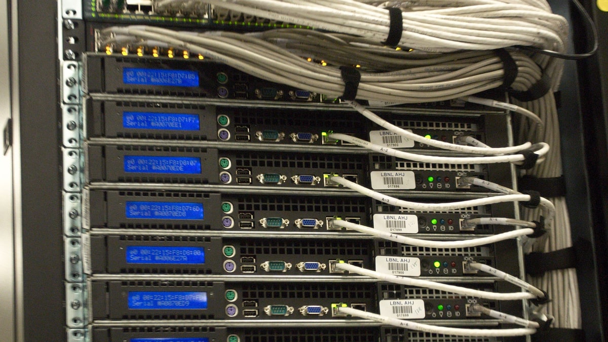A rack of servers with network cables in a data centre OpenAI's illustration for its post on securing its frontier model training environment