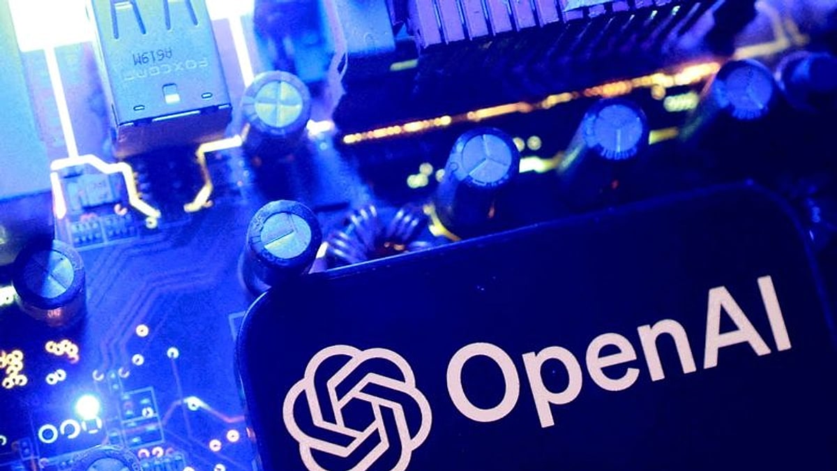 The OpenAI logo on a smartphone resting on a computer circuit board