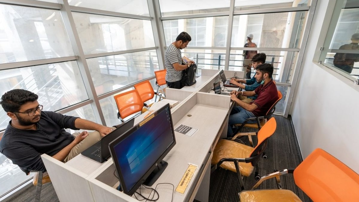 Freelancers working on computers at a remote-work office in Karachi