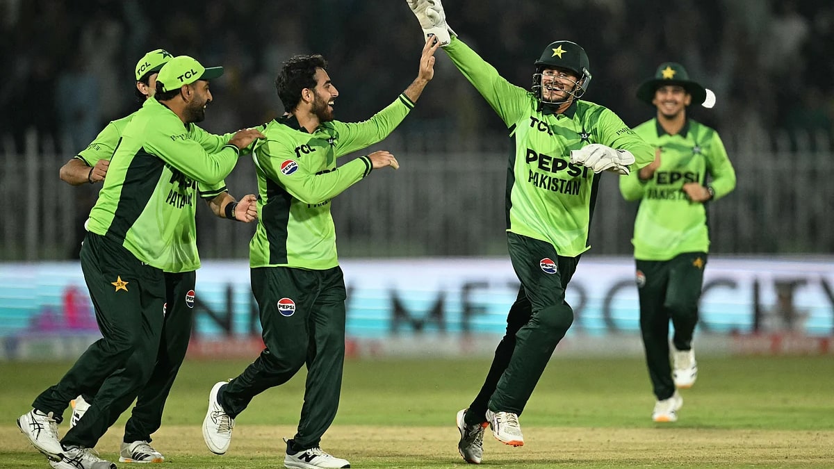 Pakistan players in green kits celebrate a wicket during the ODI tri-series