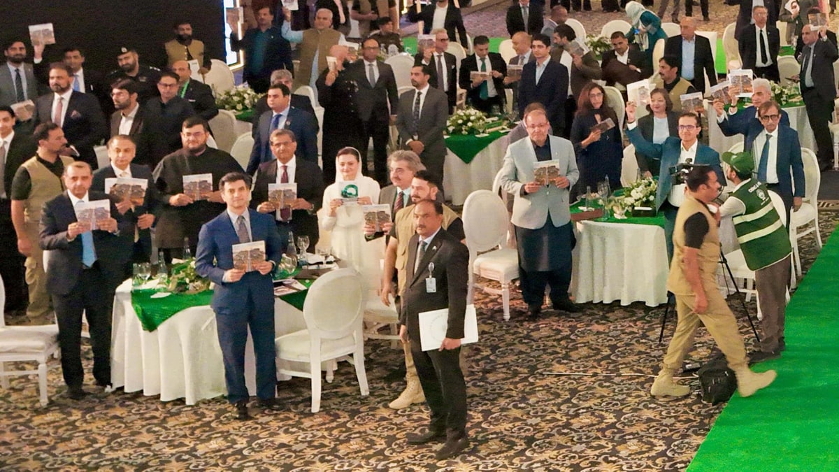 Maryam Nawaz and guests hold up PIVOT plan booklets at the launch ceremony in Lahore