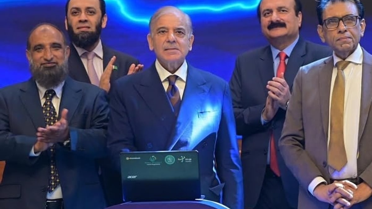 Prime Minister Shehbaz Sharif launches the PM Youth Chromebook Scheme on a laptop in Islamabad, with officials applauding