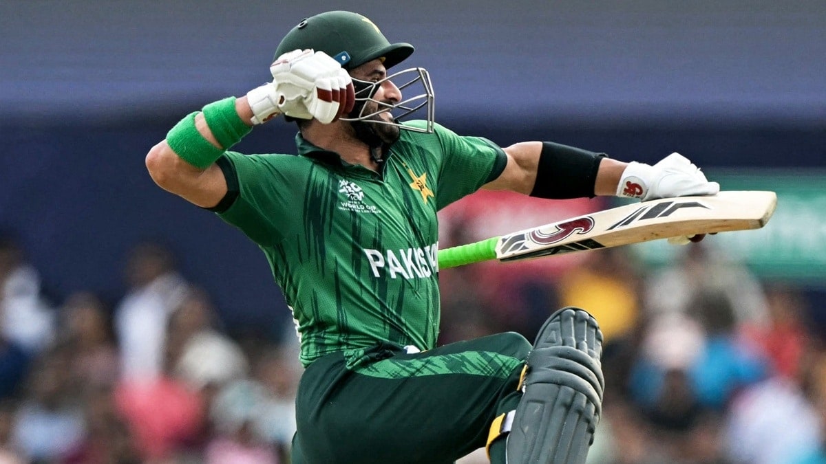 Sahibzada Farhan celebrating with his bat raised in Pakistan's T20 World Cup kit